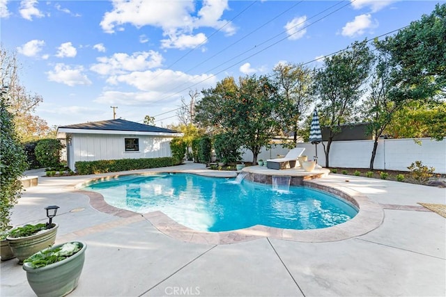 view of swimming pool with pool water feature and a patio area