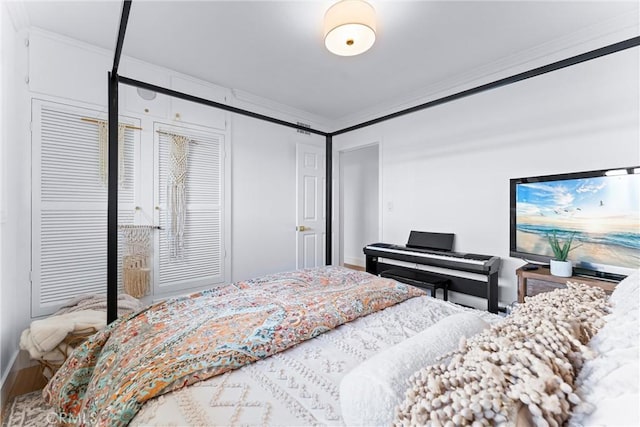 bedroom featuring hardwood / wood-style flooring and ornamental molding