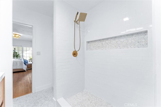 bathroom featuring a tile shower