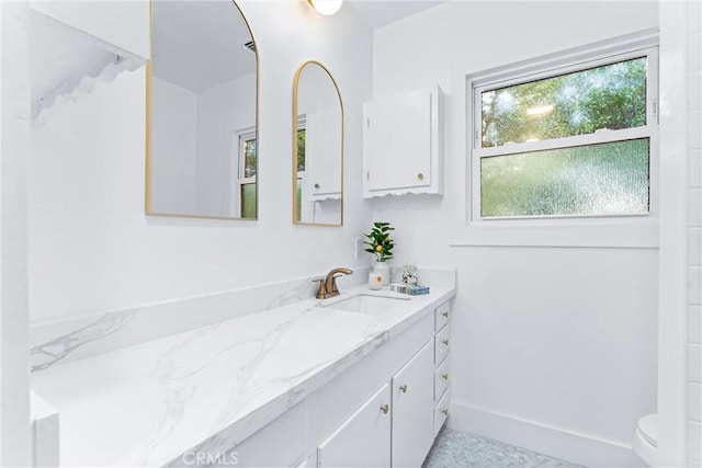 bathroom featuring vanity and toilet