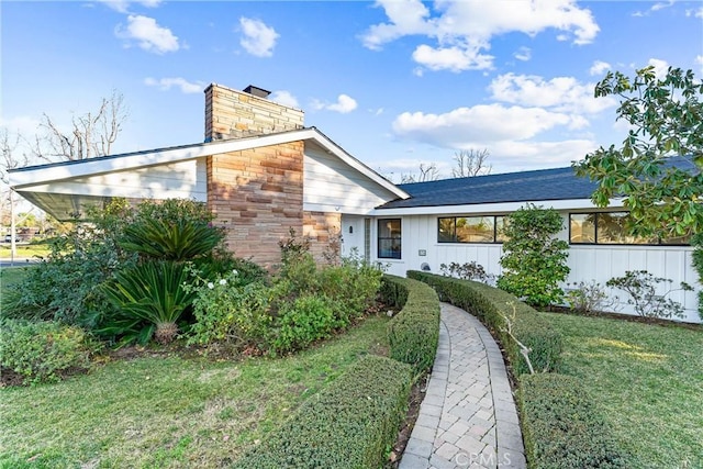 exterior space with a front lawn