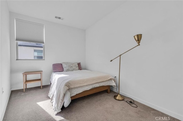 bedroom with baseboards, visible vents, and carpet flooring