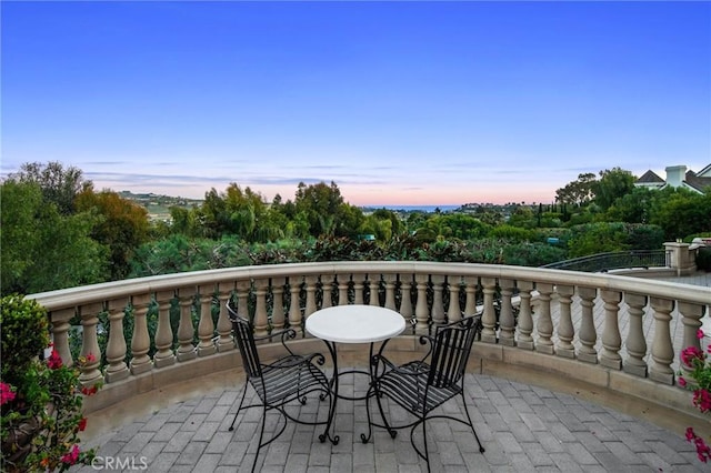 balcony at dusk with a patio area