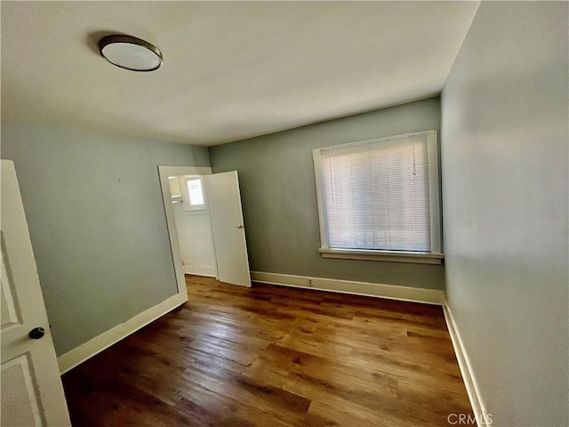 1143 S Manhattan Pl, Los Angeles, CA 90019 - spare room featuring wood finished floors and baseboards