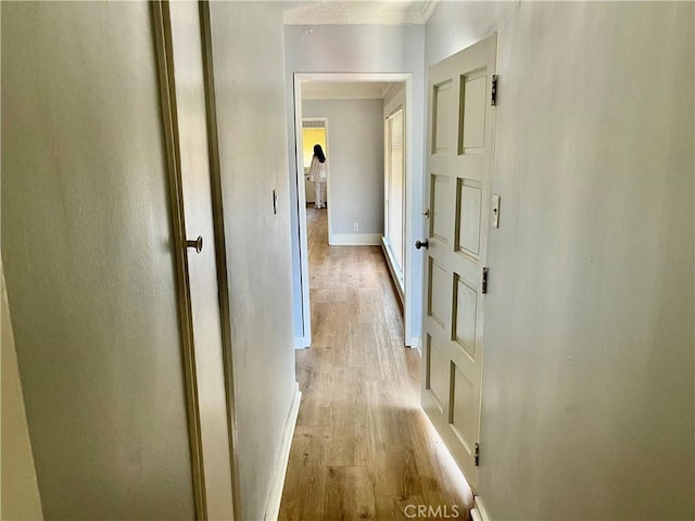 1143 S Manhattan Pl, Los Angeles, CA 90019 - hallway featuring light wood finished floors and baseboards