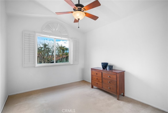 carpeted bedroom featuring vaulted ceiling and ceiling fan