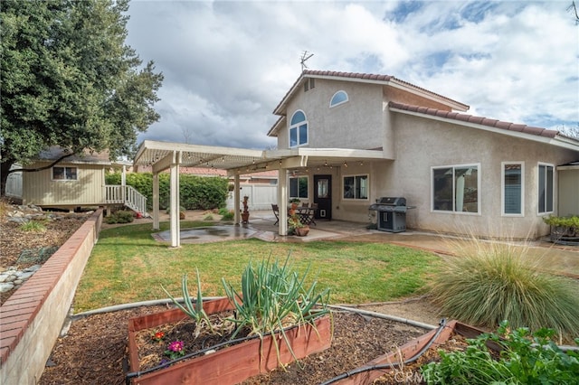 back of house featuring a pergola, a lawn, a shed, and a patio area