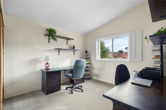 carpeted office space with lofted ceiling