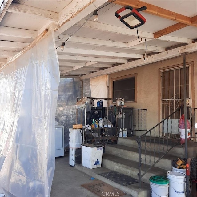 view of exterior entry with washer / clothes dryer