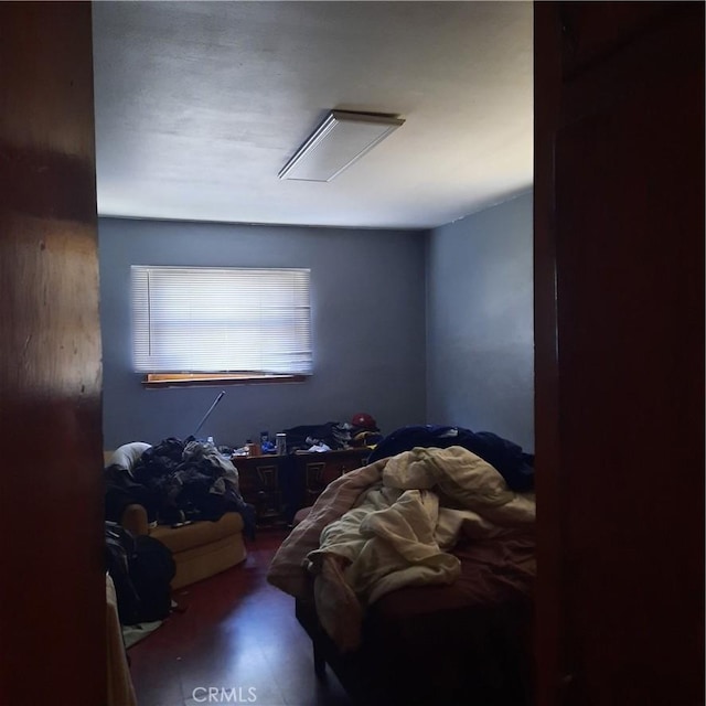 bedroom with wood-type flooring