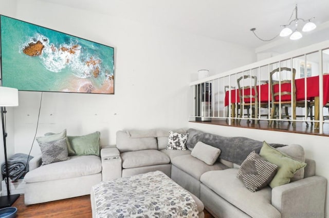 living room featuring hardwood / wood-style floors and an inviting chandelier