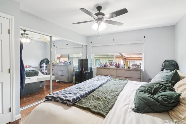 bedroom with dark wood-type flooring and ceiling fan