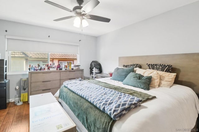 bedroom with hardwood / wood-style flooring and ceiling fan