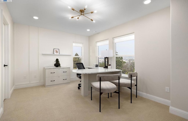 office space with light carpet and an inviting chandelier