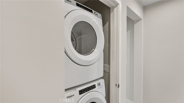 washroom with stacked washer and clothes dryer