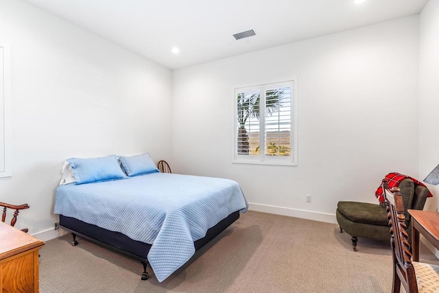 bedroom with light colored carpet