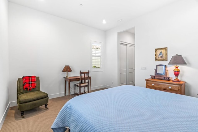 carpeted bedroom with a closet