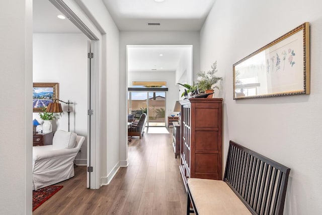 corridor featuring dark hardwood / wood-style floors