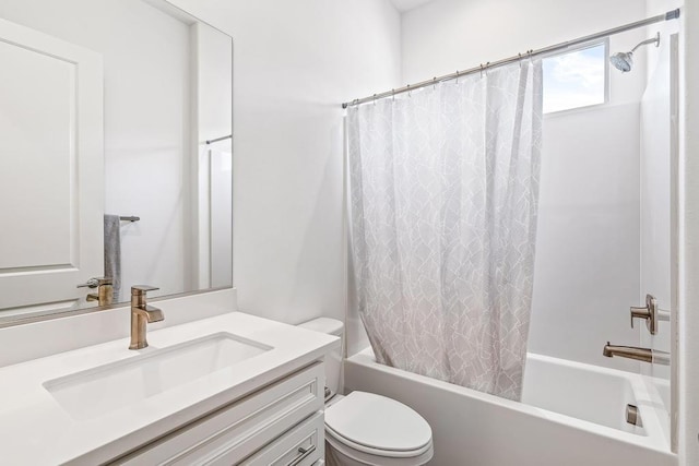 full bathroom featuring vanity, shower / tub combo with curtain, and toilet