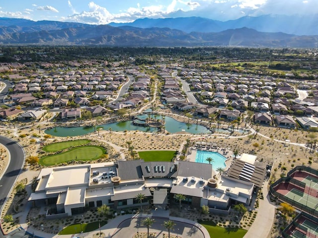 birds eye view of property with a water and mountain view