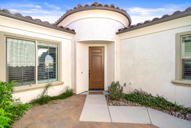 property entrance with a patio area