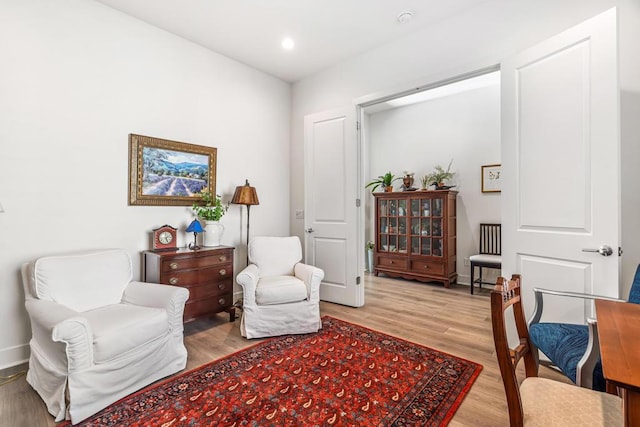 sitting room featuring light hardwood / wood-style floors