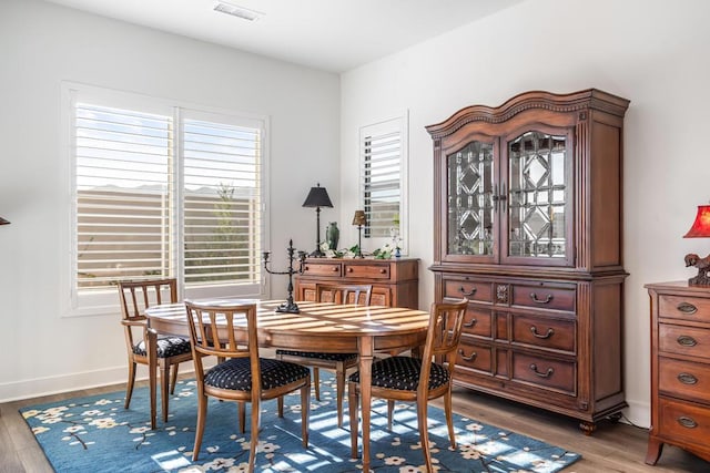 dining room with hardwood / wood-style floors