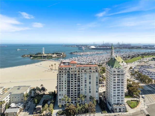 aerial view with a water view and a beach view