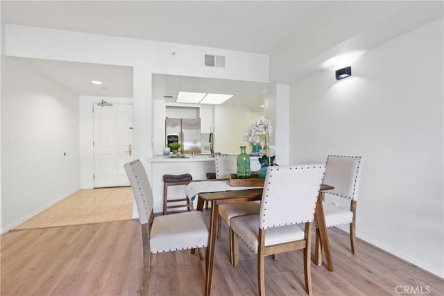 dining room with light wood-type flooring