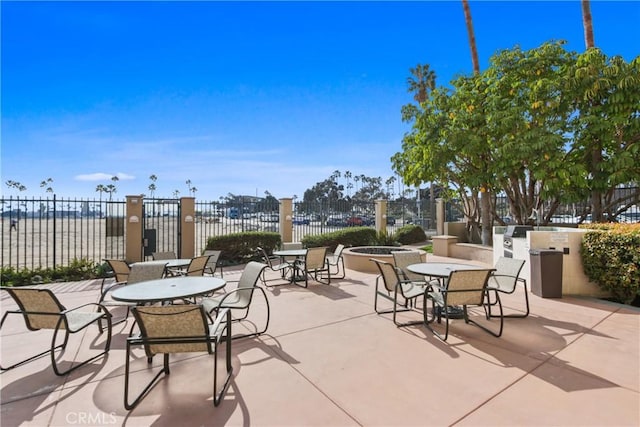 view of patio featuring a water view