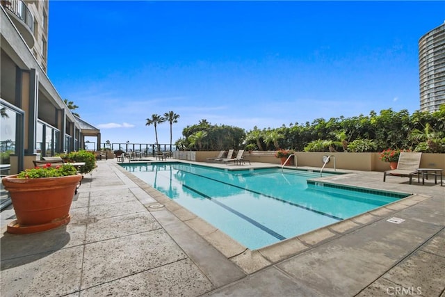 view of pool featuring a patio