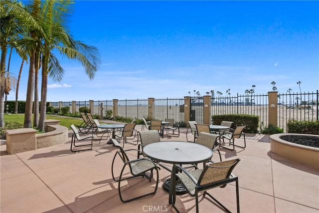 view of patio featuring a water view