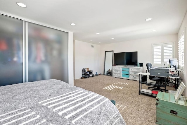 carpeted bedroom featuring a closet