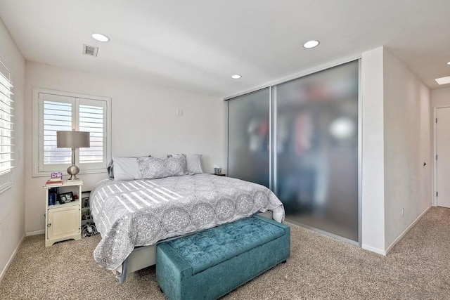 carpeted bedroom with a closet