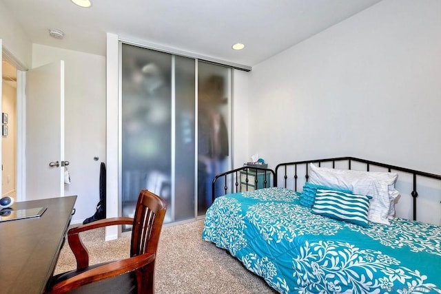 bedroom with carpet floors and a closet