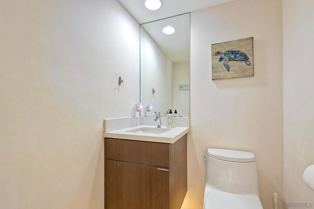 bathroom with vanity and toilet