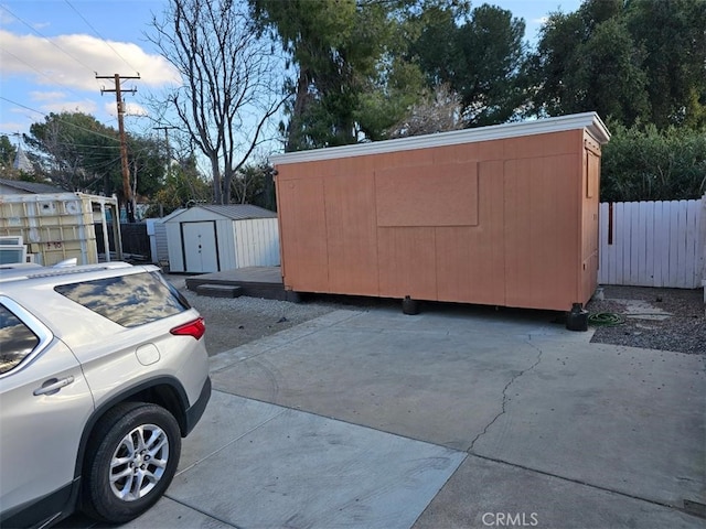 view of property exterior featuring a storage unit