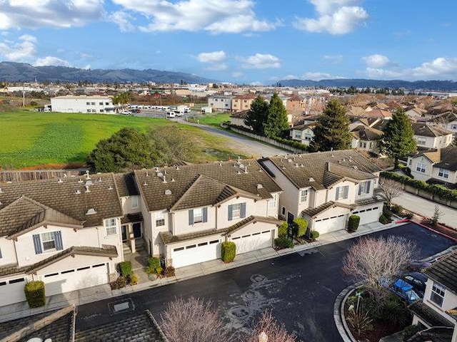 birds eye view of property with a mountain view