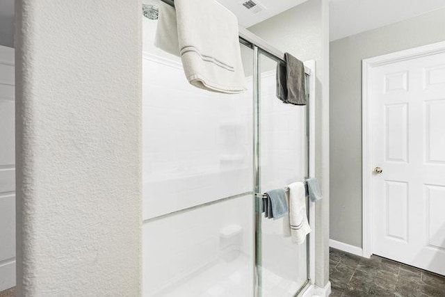 bathroom featuring an enclosed shower