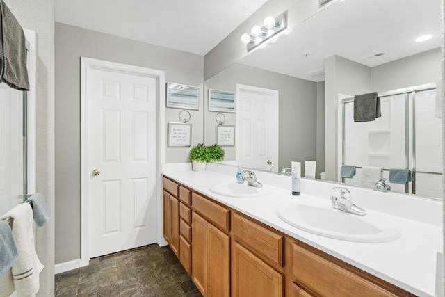 bathroom with vanity and an enclosed shower