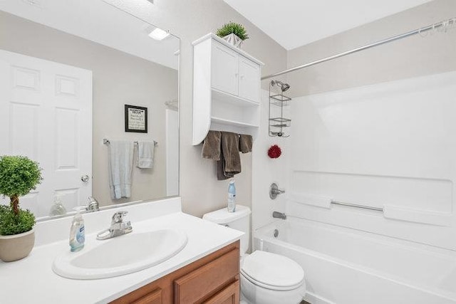 full bathroom featuring vanity, shower / bathing tub combination, and toilet