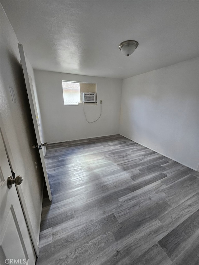 spare room with dark hardwood / wood-style floors