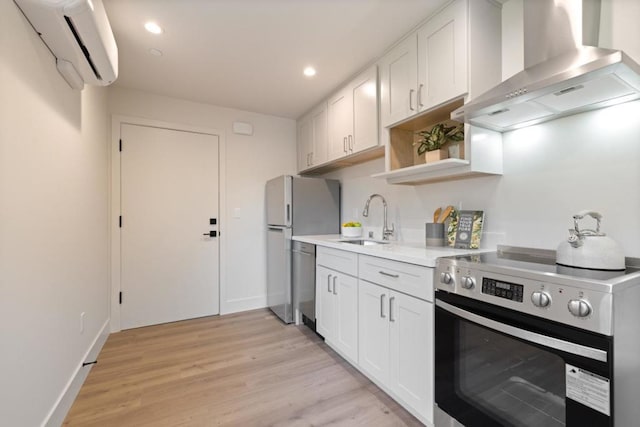 kitchen featuring white cabinetry, stainless steel appliances, sink, and extractor fan