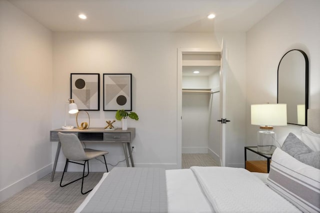 bedroom featuring a walk in closet and a closet