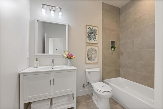 full bathroom with vanity, tiled shower / bath, and toilet