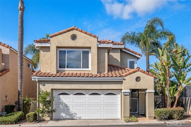 mediterranean / spanish house with a garage