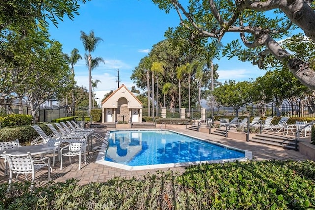 view of swimming pool with a patio area