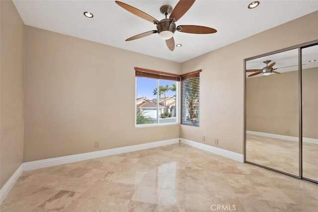 unfurnished bedroom featuring a closet and ceiling fan