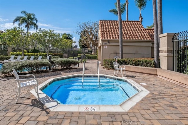 view of pool featuring a community hot tub