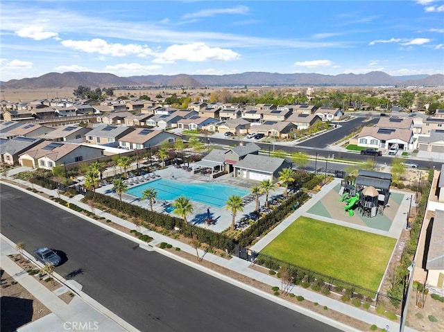 birds eye view of property with a mountain view